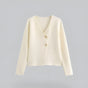 Women's V-neck button front knit cardigan with long sleeves and short hem