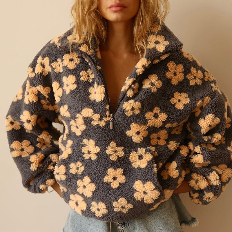 Women's floral fleece pullover with half-zip collar and front pocket