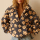 Women's floral fleece pullover with half-zip collar and front pocket