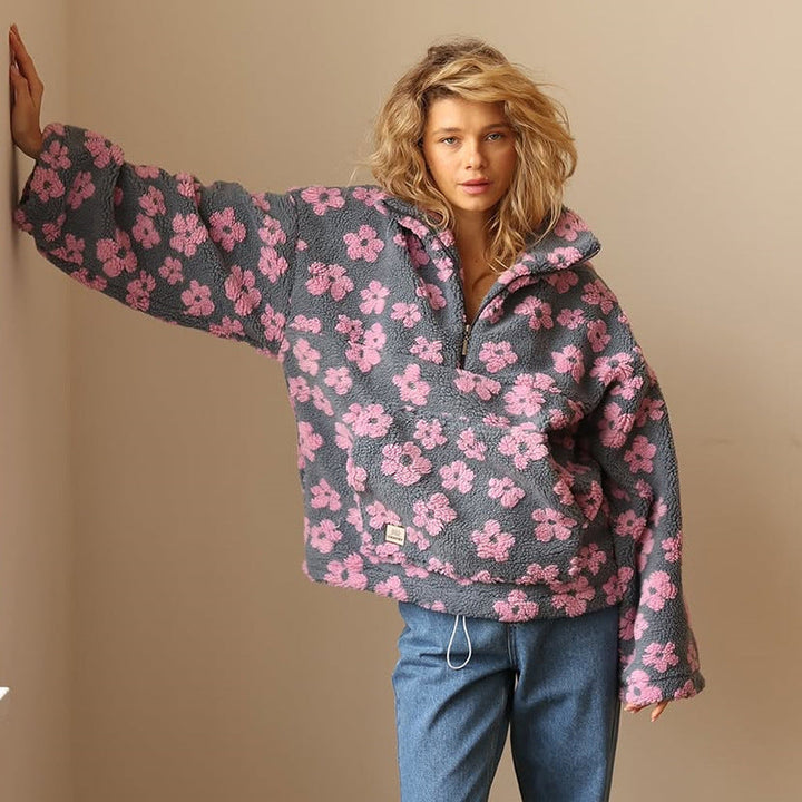 Women's floral fleece pullover with half-zip collar and front pocket