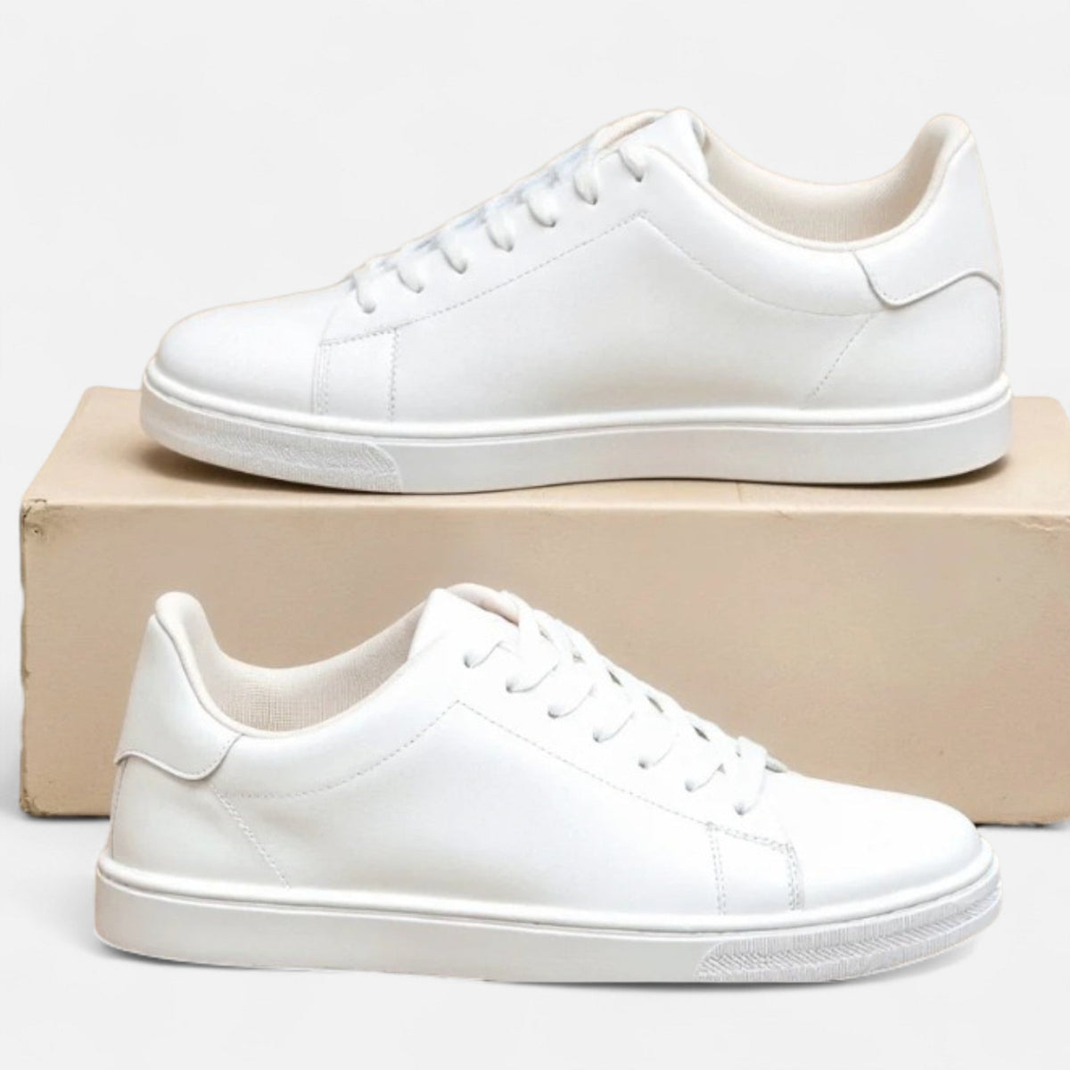 Men's white low-top lace-up sneakers with round toes and flat soles