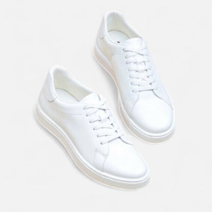 Men's white low-top lace-up sneakers with round toes and flat soles