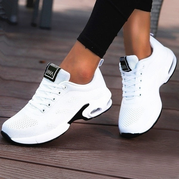 Women's lace-up sneakers with perforated panels and air cushion sole