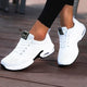 Women's lace-up sneakers with perforated panels and air cushion sole