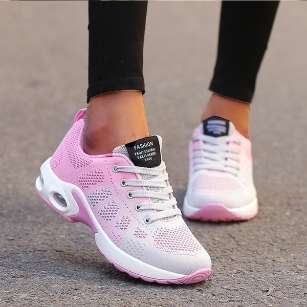 Women's lace-up sneakers with perforated panels and air cushion sole