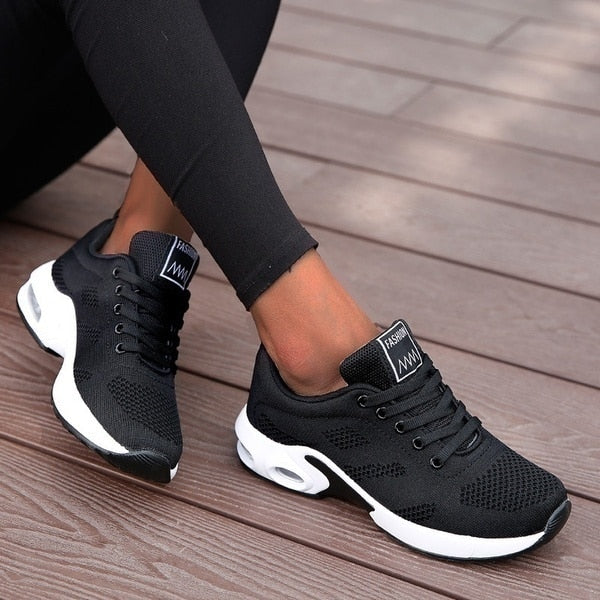 Women's lace-up sneakers with perforated panels and air cushion sole