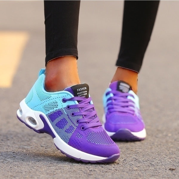 Women's lace-up sneakers with perforated panels and air cushion sole