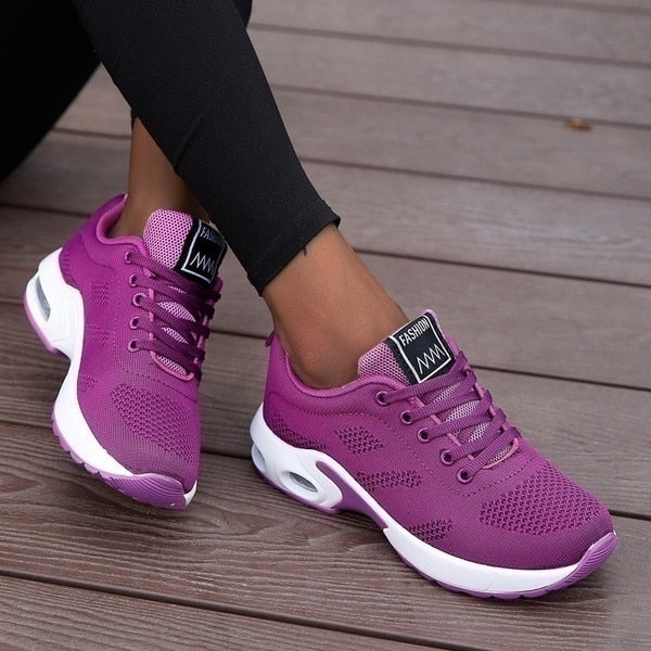 Women's lace-up sneakers with perforated panels and air cushion sole