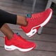 Women's lace-up sneakers with perforated panels and air cushion sole