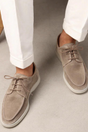 Men's lace-up loafers with rounded moc toes and contrasting flat soles