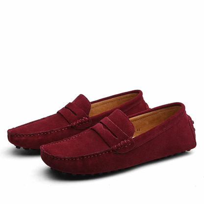 Men's slip-on loafers with moc toe stitching and penny strap detail