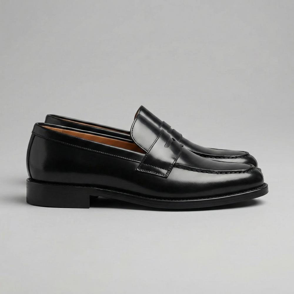 Men's black penny loafers with rounded toes and low heels