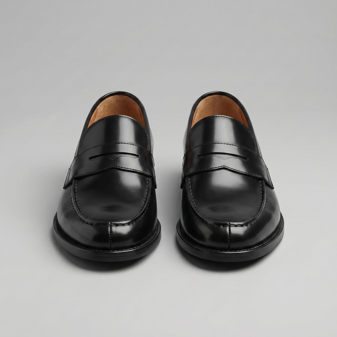 Men's black penny loafers with rounded toes and low heels