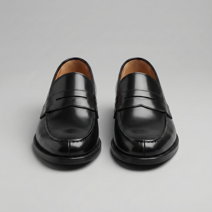 Men's black penny loafers with rounded toes and low heels