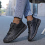 Women's casual lace-up sneakers with strap detail, contrast stitching and flat soles