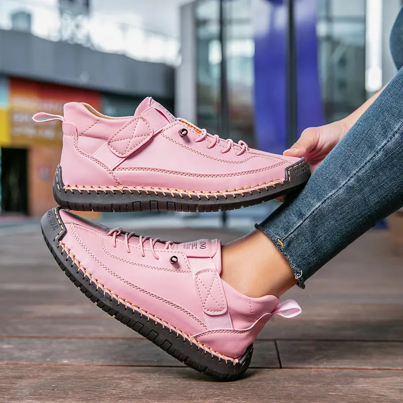 Women's casual lace-up sneakers with strap detail, contrast stitching and flat soles