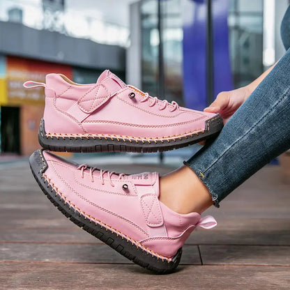 Women's casual lace-up sneakers with strap detail, contrast stitching and flat soles