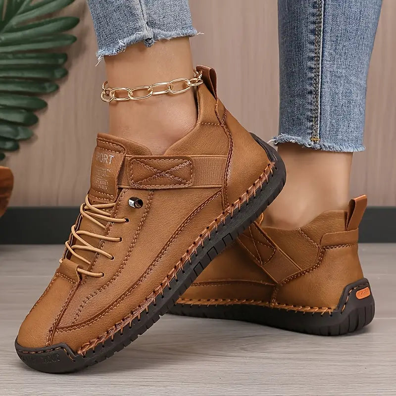 Women's casual lace-up sneakers with strap detail, contrast stitching and flat soles
