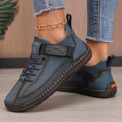 Women's casual lace-up sneakers with strap detail, contrast stitching and flat soles