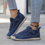 Women's casual lace-up sneakers with strap detail, contrast stitching and flat soles