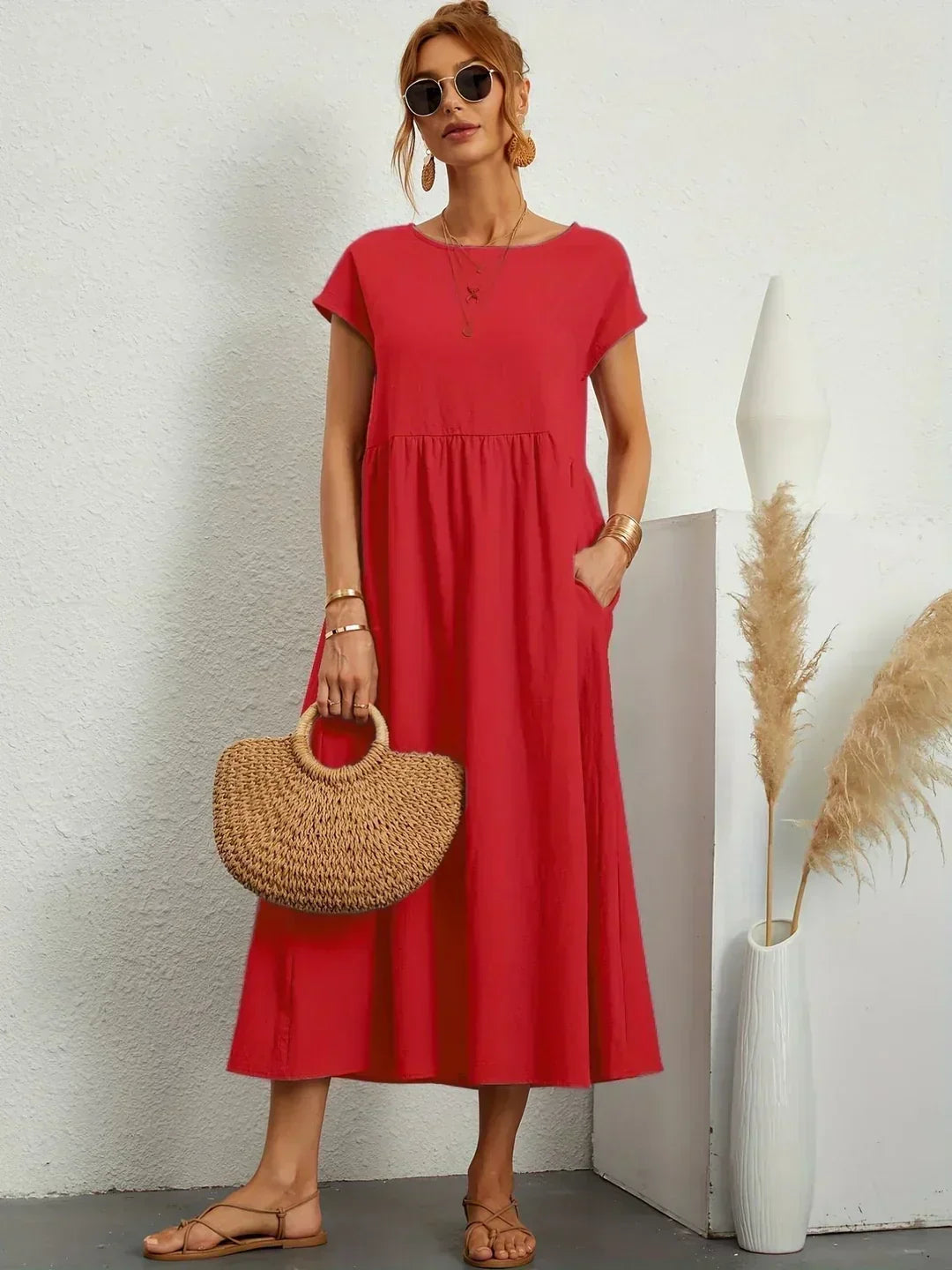 Women's flowing midi dress with round neck and short sleeves, shown in white and navy