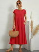Women's flowing midi dress with round neck and short sleeves, shown in white and navy