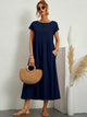 Women's flowing midi dress with round neck and short sleeves, shown in white and navy