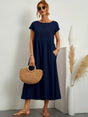 Women's flowing midi dress with round neck and short sleeves, shown in white and navy