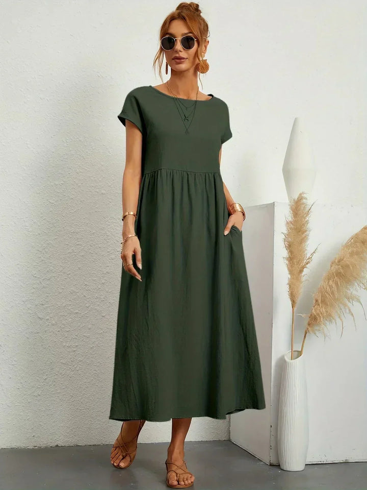 Women's flowing midi dress with round neck and short sleeves, shown in white and navy
