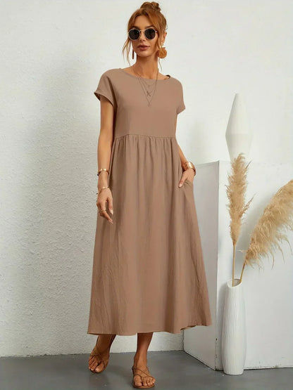 Women's flowing midi dress with round neck and short sleeves, shown in white and navy