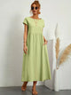 Women's flowing midi dress with round neck and short sleeves, shown in white and navy