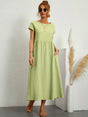 Women's flowing midi dress with round neck and short sleeves, shown in white and navy