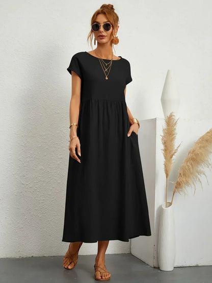 Women's flowing midi dress with round neck and short sleeves, shown in white and navy