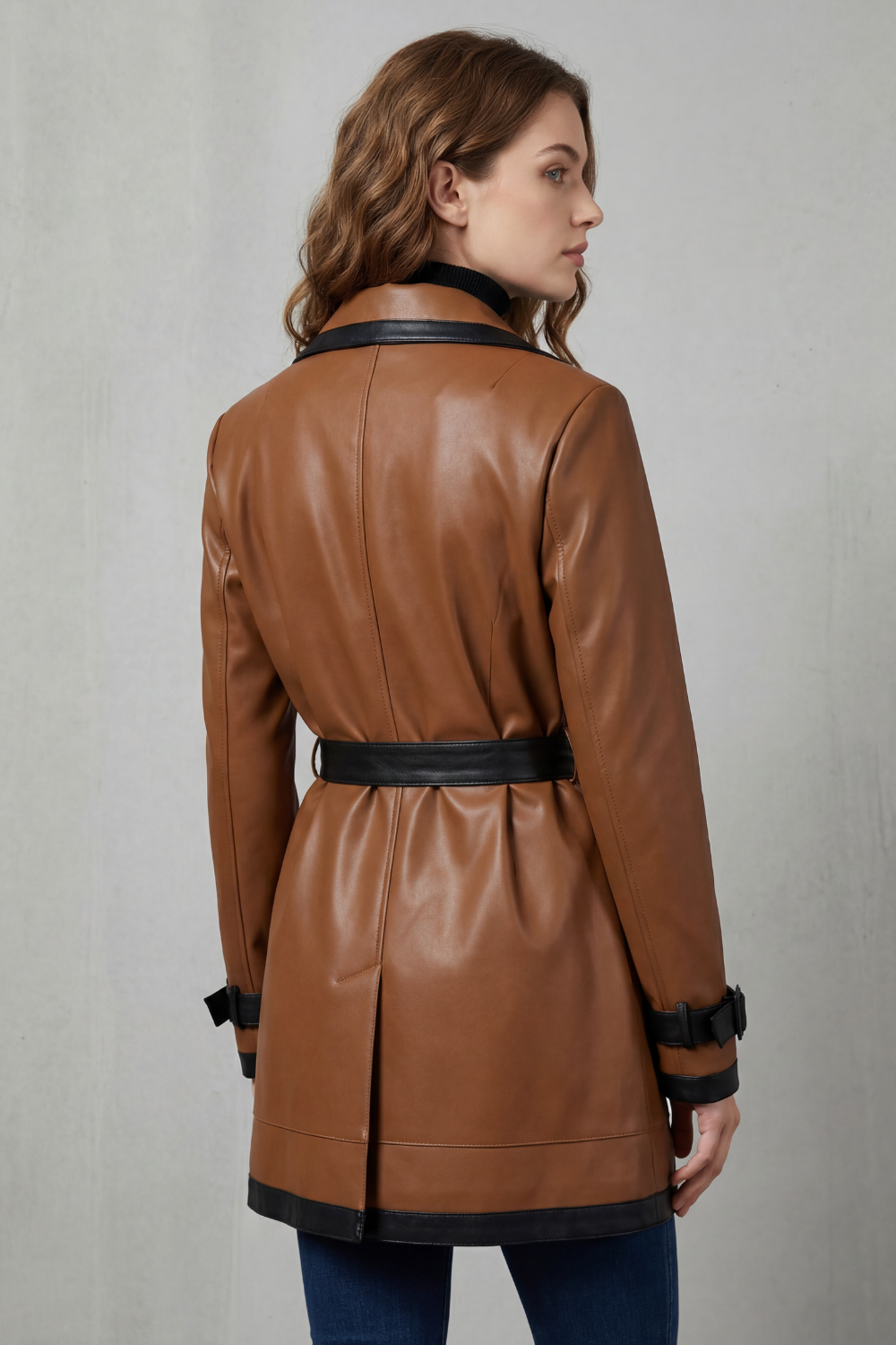 Women's brown belted trench coat with black contrast trim and long sleeves