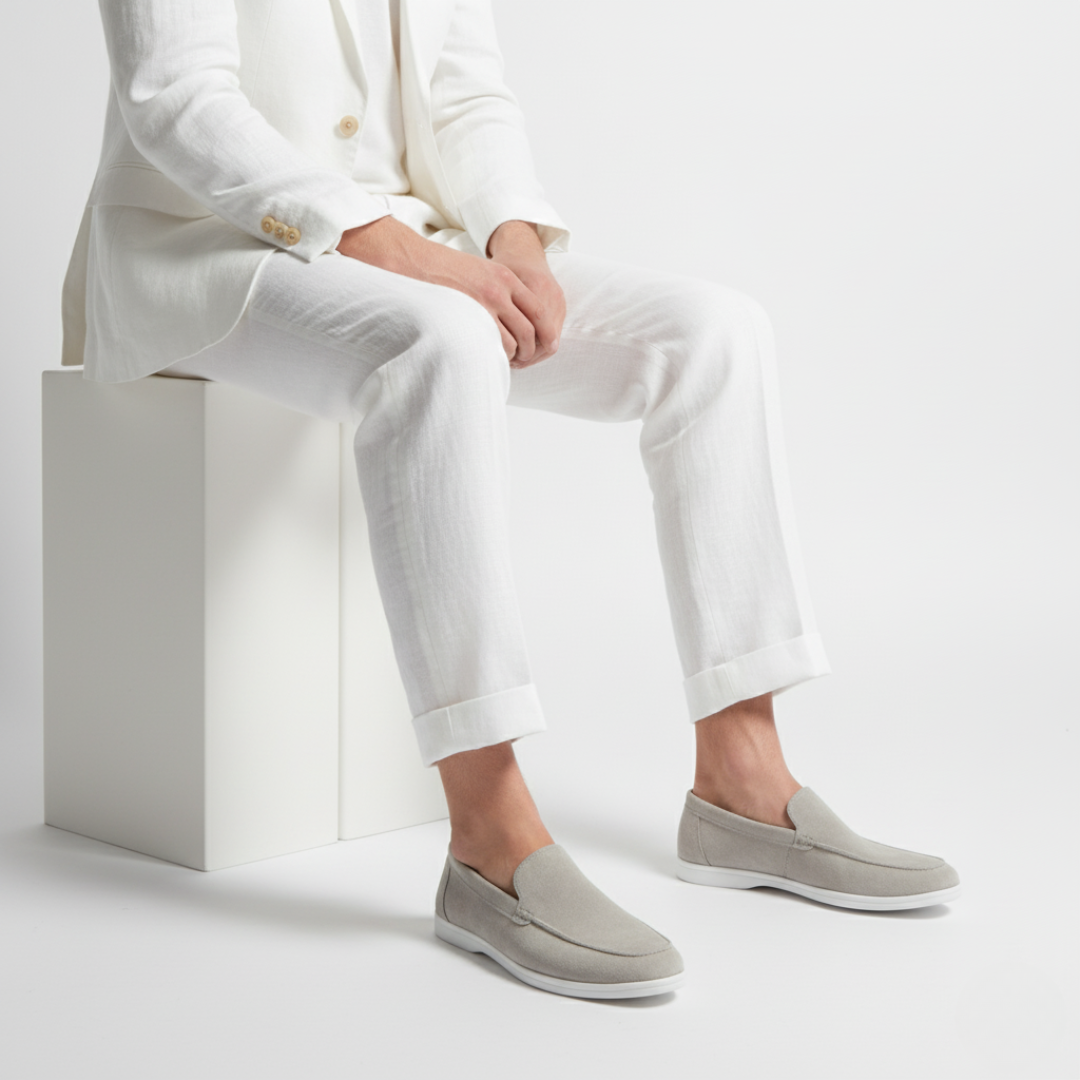 Men's plain slip-on loafers with moc toe stitching and flat light-coloured soles