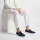 Men's plain slip-on loafers with moc toe stitching and flat light-coloured soles