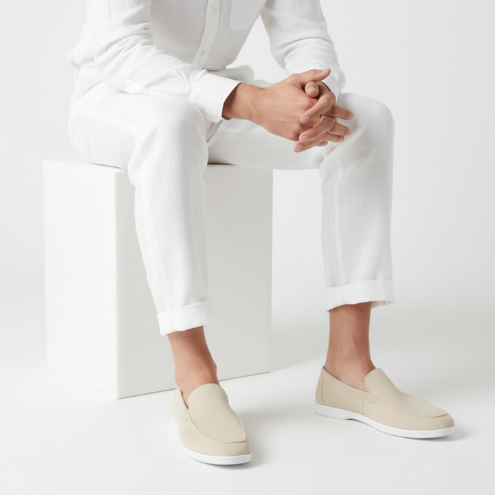 Men's plain slip-on loafers with moc toe stitching and flat light-coloured soles