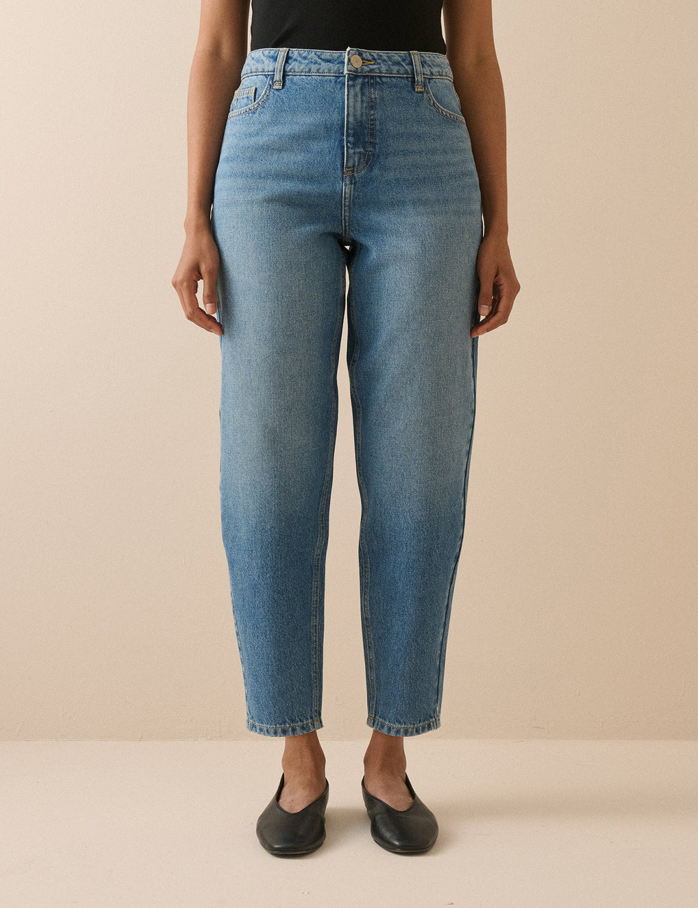 Women's blue barrel leg jeans with high-rise waist and cropped ankle-length hems