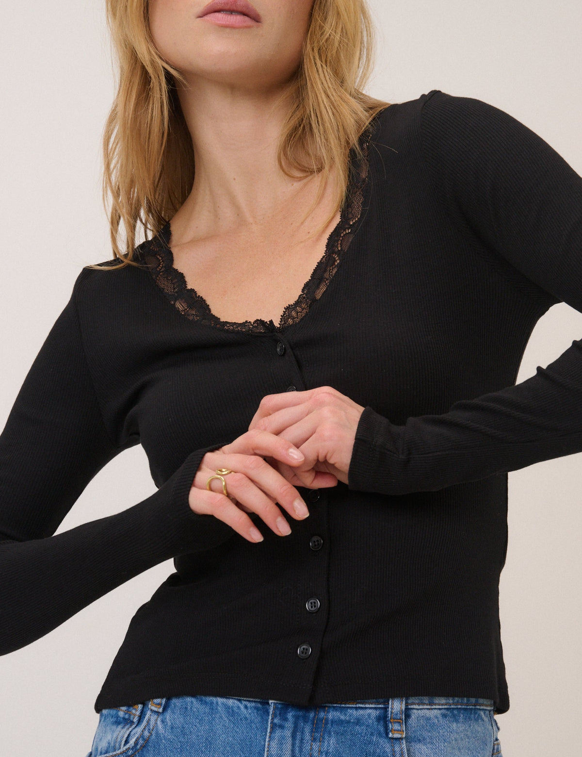 Women's black ribbed cardigan with lace-trimmed V-neckline and front buttons