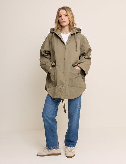 Women's olive green hooded parka jacket with long sleeves and utility pockets