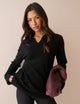 Women's black long-sleeve V-neck jumper with open collar and ribbed trims