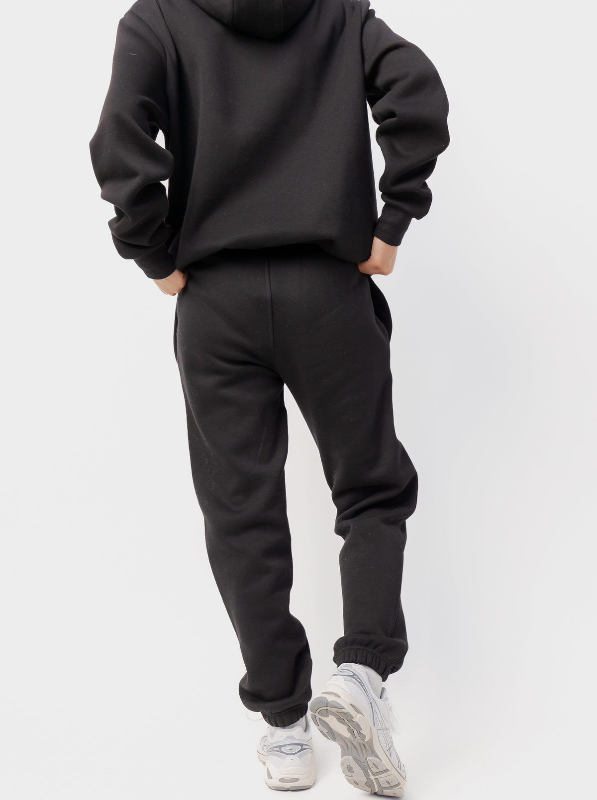 Women's black tapered logo jogger pants with drawstring waist and elasticated cuffs