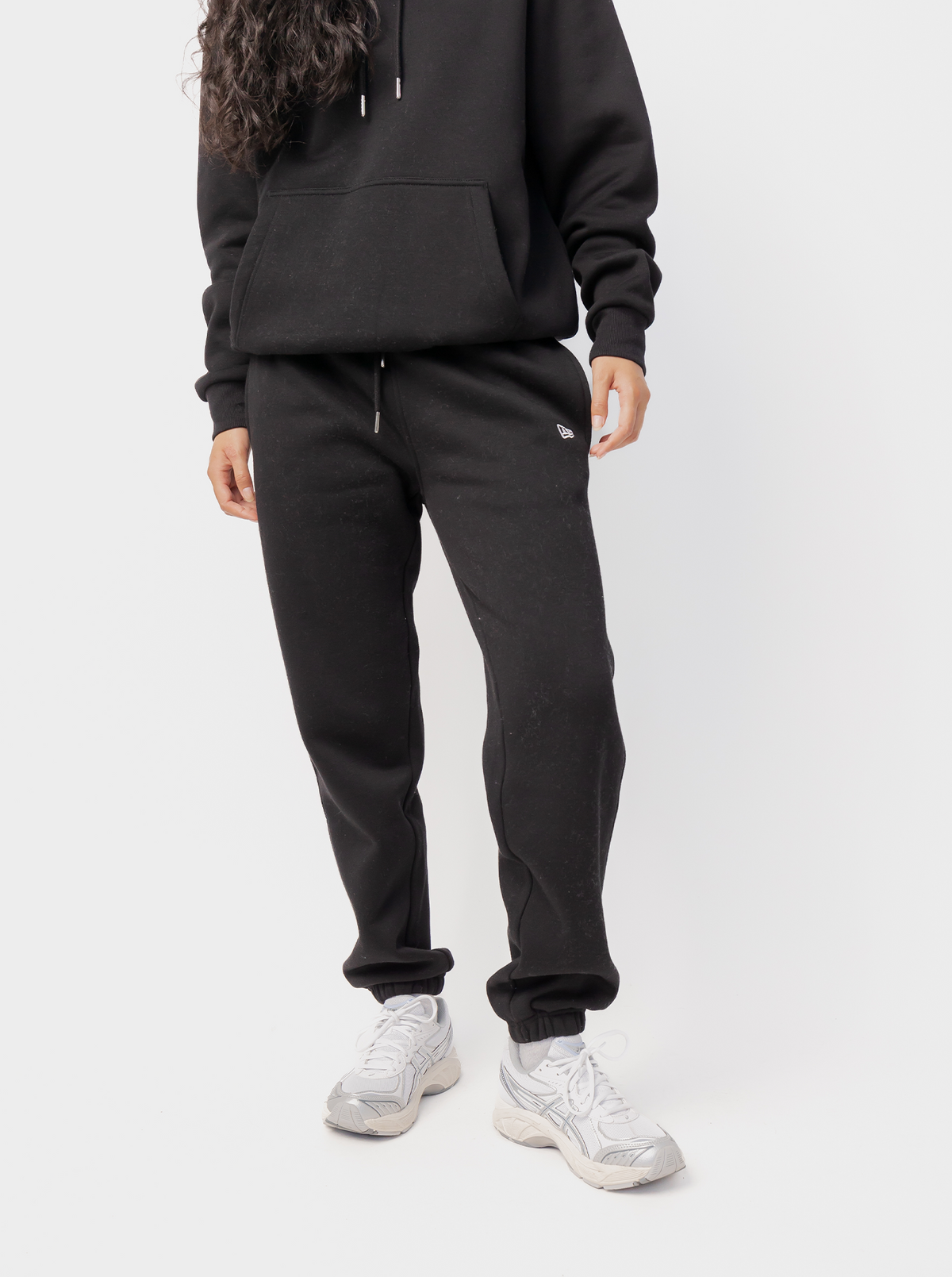 Women's black tapered logo jogger pants with drawstring waist and elasticated cuffs