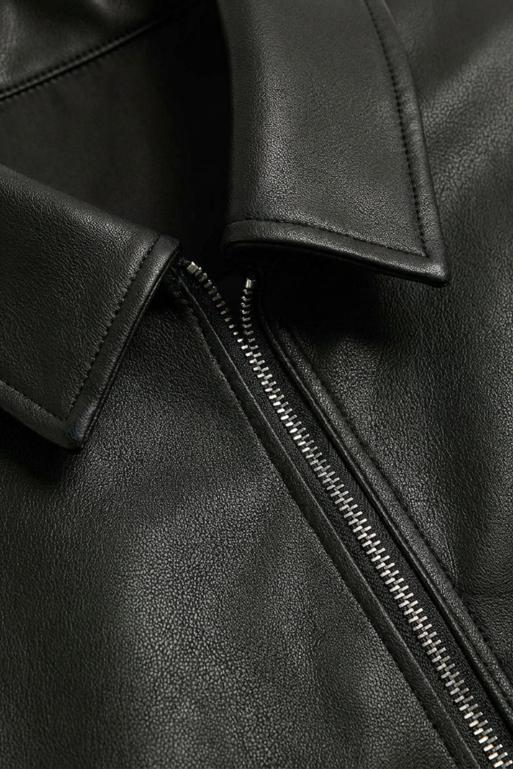 Men's black jacket with pointed collar, front zipper, side pockets and snap cuffs