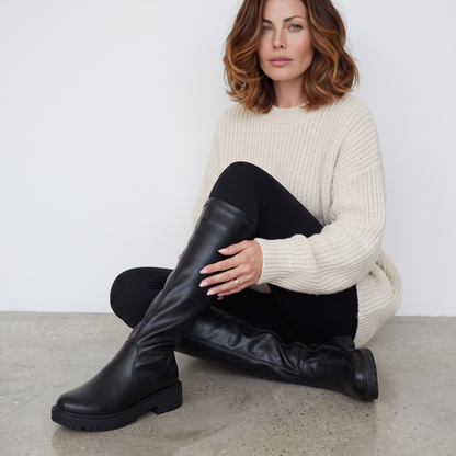 Black women's knee-high boots with round toes, low heels and side zippers