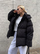Women's oversized hooded puffer jacket with quilted panels