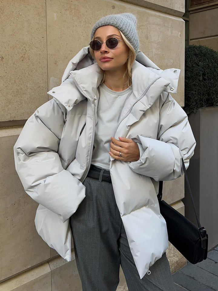 Women's oversized hooded puffer jacket with quilted panels