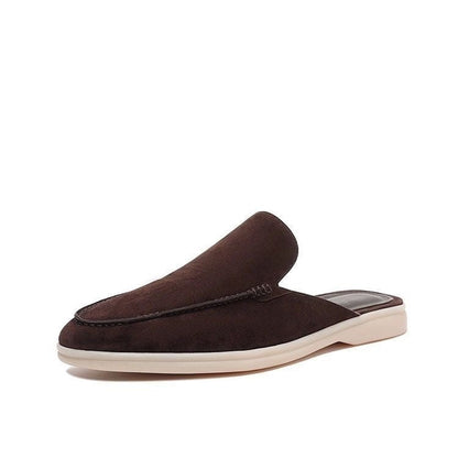 Moc toe slip-on loafers with stitched trim and low flat soles