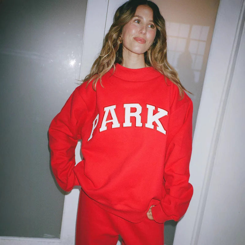 Women's oversized varsity sweatshirt with mock neck and front lettering