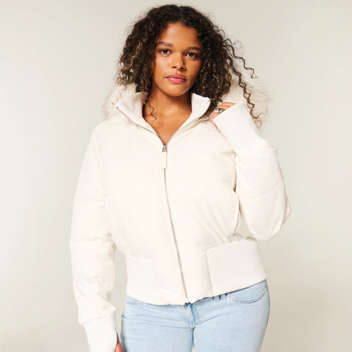 Women's quilted hooded puffer jacket with zip front and ribbed trims